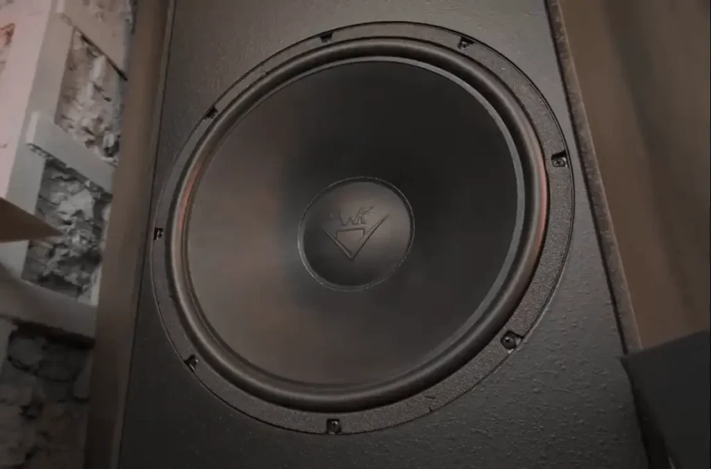 A Closer Look of 15-inch rear-mounted passive radiator on the Klipsch Forte IV speaker with a PWK logo on the cap