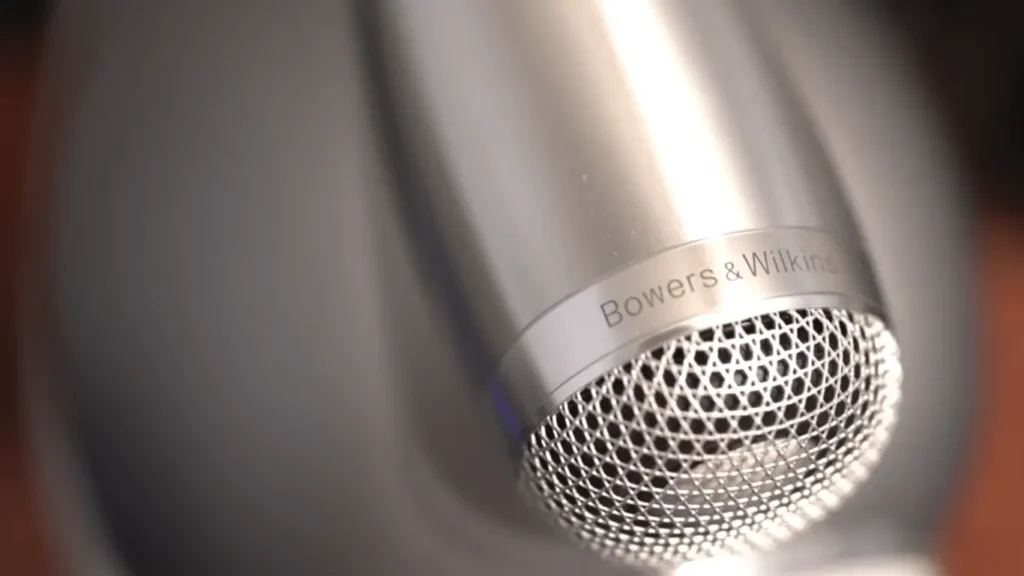 A Closer Look of the Bowers & Wilkins 803 D4 tweeter, focusing on the logo on the solid body aluminum housing and the intricate protective grille in my review.