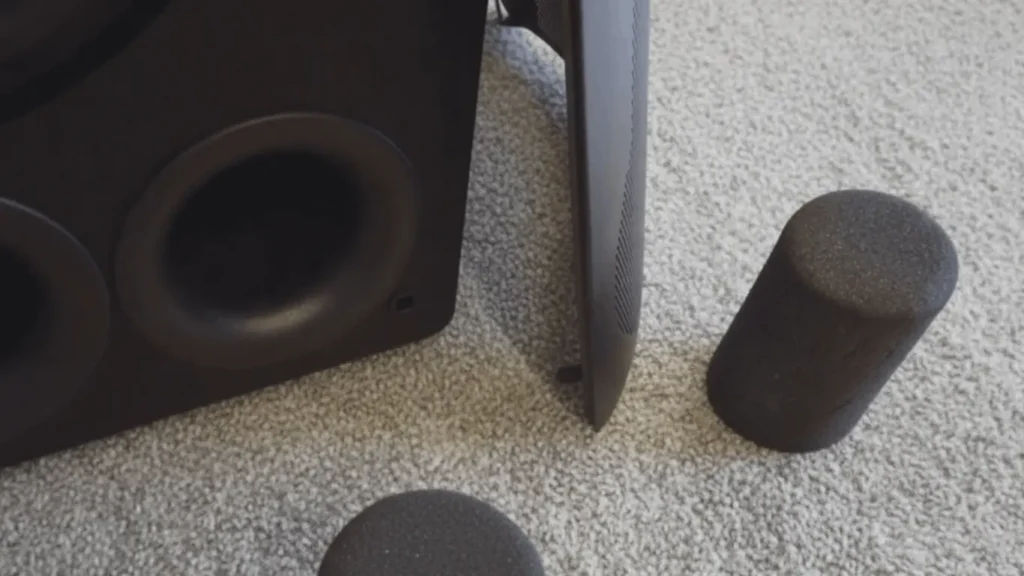 SVS PB-4000 subwoofer with dual front bass ports and foam port plugs placed on carpet for tuning control