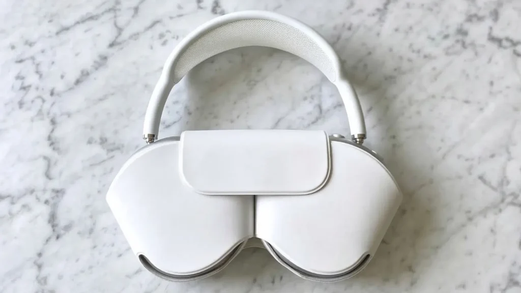 AirPods Max 2 in Silver colorway, top-down product shot showing polished aluminum ear cups and mesh headband