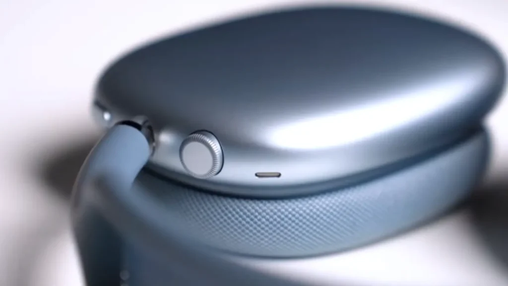 Apple AirPods Max Digital Crown volume control and noise cancellation button macro shot on the aluminum ear cup