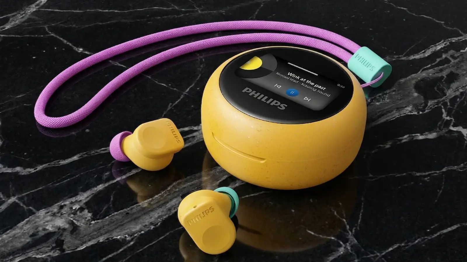 Philips Moving Sound Buds MS3 true wireless earbuds in yellow with purple ear tips displayed alongside the round yellow charging case with color display on black marble surface